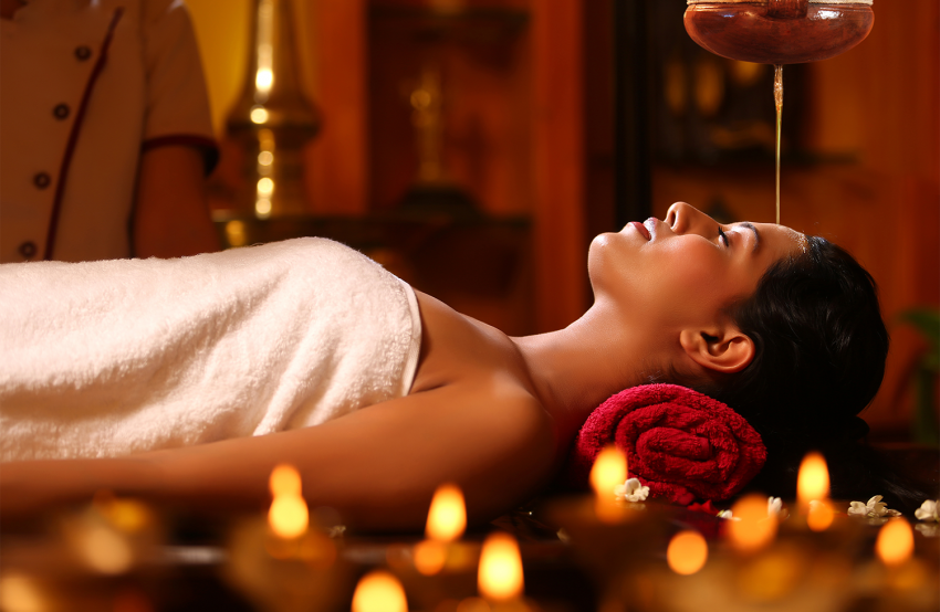 Shirodhara Ayurvedic treatment with warm herbal oil for relaxation